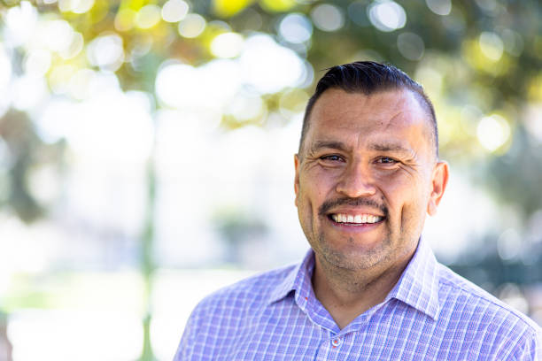 Portrait of a Handsome Mexican man at the park.